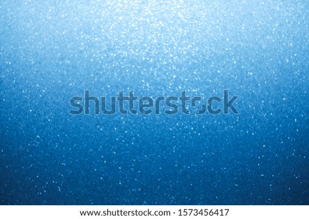 Festive Blue Background with Star Shaped Bokeh Effect