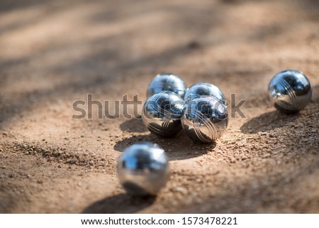 French pétanque outdoor traditional game in the provence during holidays Royalty-Free Stock Photo #1573478221