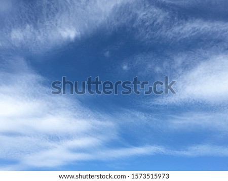 blue sky with soft clouds. blue sky and a fluffy clouds.