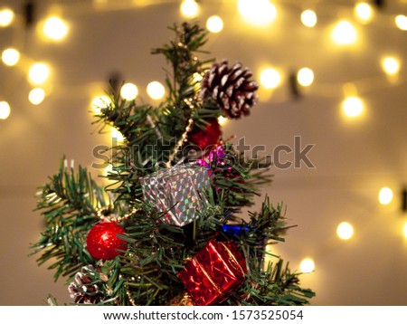 Decorate Santa Claus Christmas tree on blurred background.