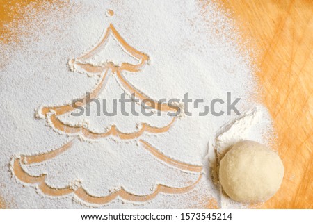 Picture of a snowman made from white flour. Merry Christmas and happy new year