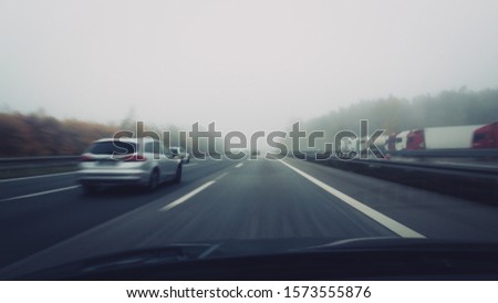 driving on dangerous foggy autobahn