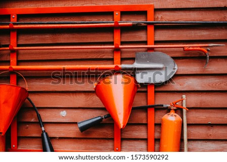 Fire First Aid Tools on Red Background