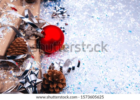 Christmas composition with Christmas gift boxes with pine cones, toys on fastive background, copy space for your congratulations