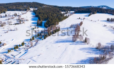 Aerial view of ski slope in Zelezna Ruda. Popular winter resort in national park Sumava, Czech republic, European union.