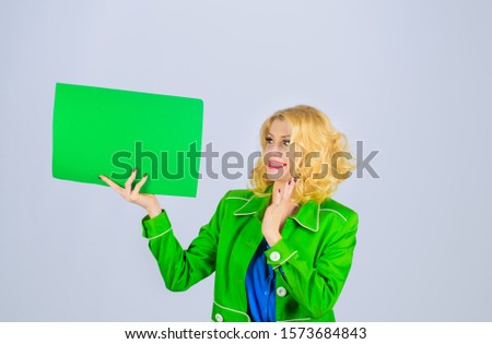 Surprised girl holds advertising board. Sign board. Copy space for text. Advertising and sale. Advertising banner. Seasons sale. Discount. Stylish woman holds sign board. Market, shop, sale, discount.