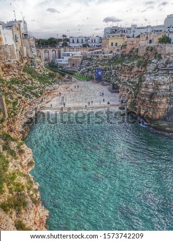 blue sea and buildings in Polignano a Mare Italy sunny weather