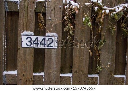 Fence with address sign 3442