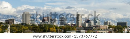 Downtown city skyline of Salt Lake City, Utah,  the Wasatch mountains in the background in autumn 