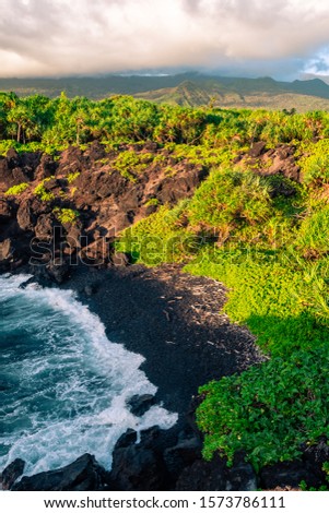 Aerial photo of Black Sand Beach at sunrise in the Waianapanapa State Park in Hana, Maui, Hawaii USA.