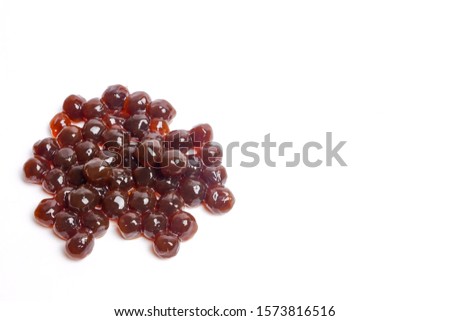 A picture of pearl tea or some call tapioca pearl used for boba tea on white background. Boba tea caused an addicted to youngsters and number of diabetes increase