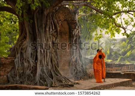 Novices learn to cover the robes and robes of monks within the temple in Ayutthaya, Thailand.