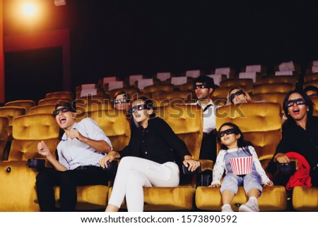 People watching 4d movie in cinema.