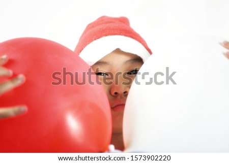 Asian kids wear santa hat hold balloon isolated on white background, New year and christmas concept. celebration and happy time.