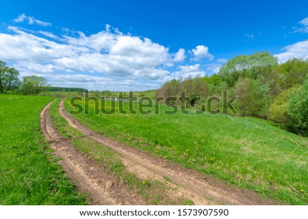 Spring photography, fields, meadows, spring beauty of ravines, amazing blue sky in white fluffy clouds, the earth wakes up after a winter cold