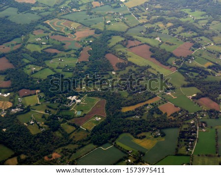 Medium wide aerial view of landscape approaching the airport, Maryland.