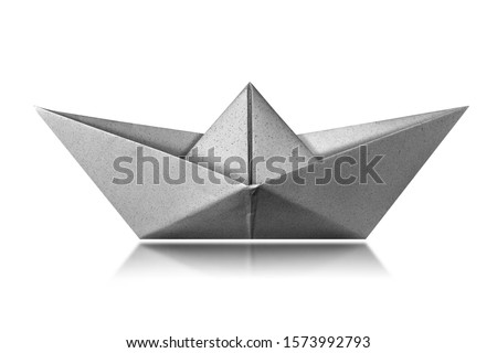White paper boat isolated on white background with reflections, photography