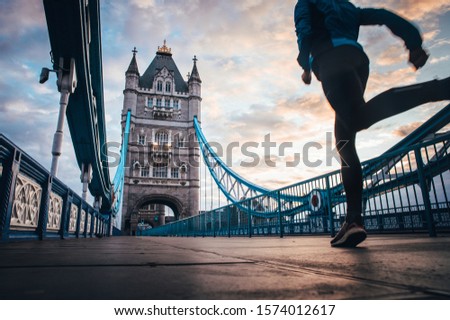 running in London Concept photo. Man running on Tower bridge. London Marathon photo Royalty-Free Stock Photo #1574012617