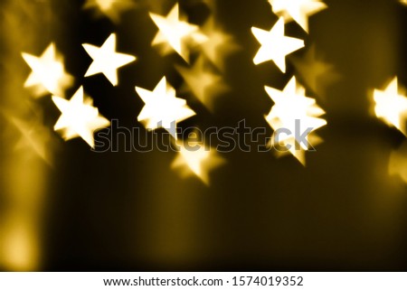 Festive overlay effect. Golden stars bokeh festive glitter background. Christmas, New Year and Valentine's day design