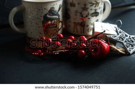    Christmas mugs with coffee decorated with Christmas tree on a black background
                            