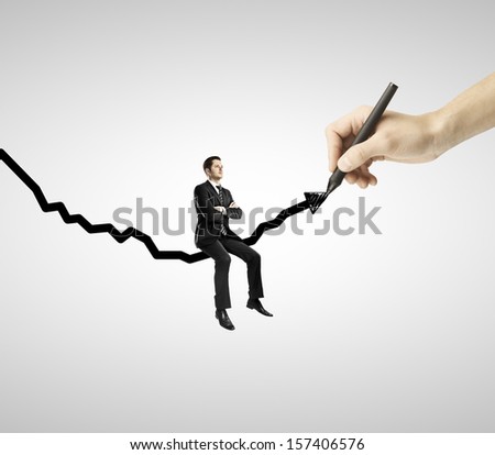 businessman sitting on drawing black arrow