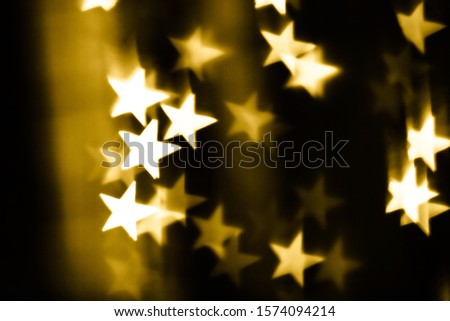Festive overlay effect. Golden stars bokeh festive glitter background. Christmas, New Year and Valentine's day design