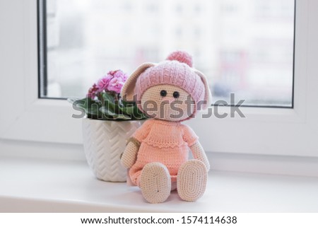knitted doll in the interior. hand made