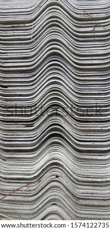 Neatly stacked house roof tiles.