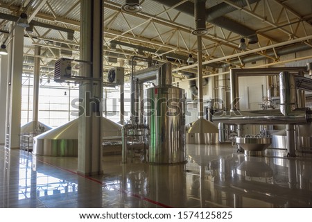 industrial equipment in the shop at the brewery, brewing shop at the brewery Royalty-Free Stock Photo #1574125825
