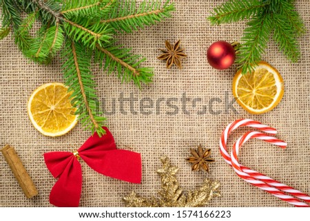 New Years Background. Christmas decoration isolated on linen texture. Xmas celebration pattern. Flat lay design. Copy Space