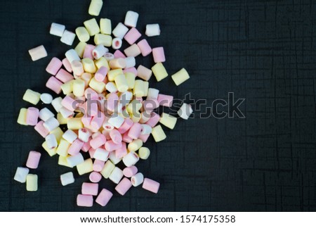 colorful Marshmallow candy on black background.