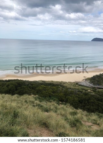 Sand beach with waves and sky views