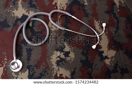 Military medical concept with stethoscope and American military digital pattern uniform.