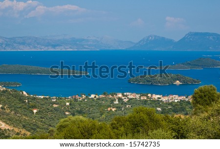 View to the town Nydri. Island of  Scorpio on the  right in the middle of the sea.