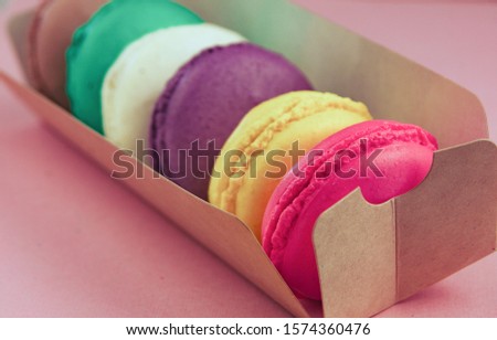 nch pastries macaroon on a colored background