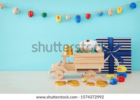religion image of jewish holiday Hanukkah background with spinning top and doughnut