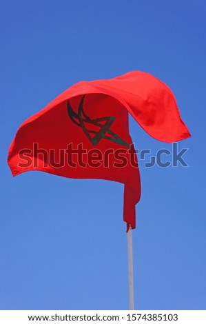  A picture of the Moroccan flag fluttering Royalty-Free Stock Photo #1574385103
