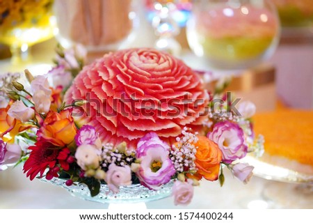 Tongmo fruits are carved into flowers to worship the Lord Buddha.