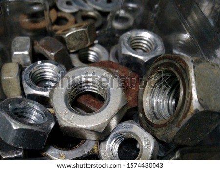 Bolts close up. Background of bolts, internal screw, many screws. Factory equipment and industrial concept.