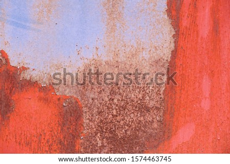 Texture of steel rusty wall being background , abstract photo style colored red , blue and brown.