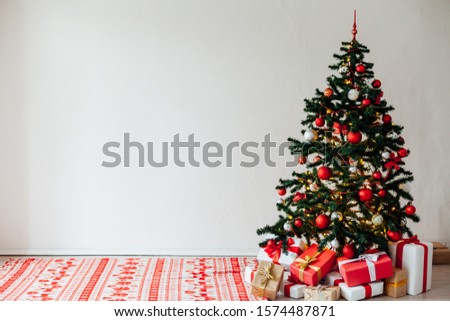 Christmas tree with red gifts decor interior for the new year