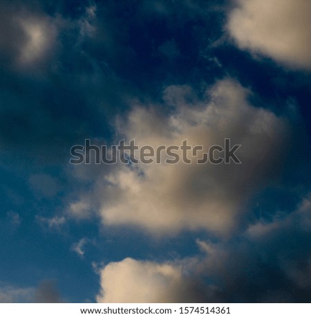 The white and gray cloudscape in the blue sky.