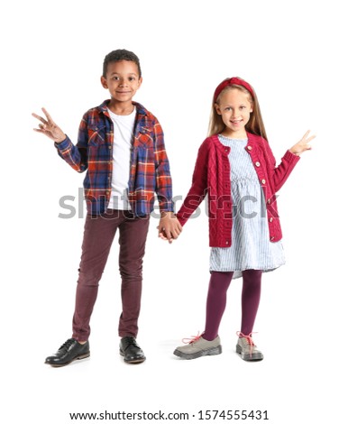 Fashionable little children in autumn clothes on white background