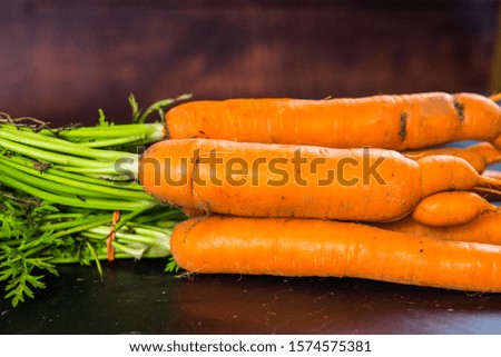 Fresh and sweet carrot on a wooden table