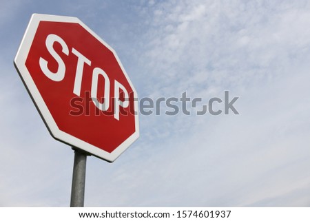 Hamburg / Germany - May 20, 2018: Stop sign and blue sky in Hamburg, Germany