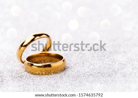 wedding ring celebration background with two gold rings Royalty-Free Stock Photo #1574635792