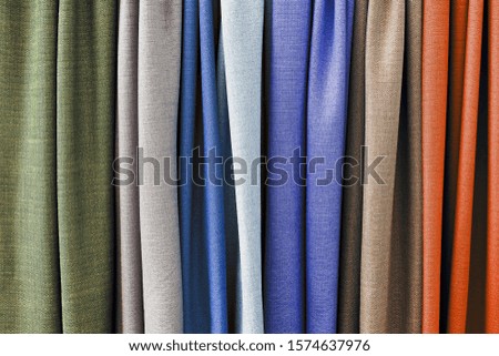 Detailed close up view on colorful and soft textile and folded cloth in high resolution