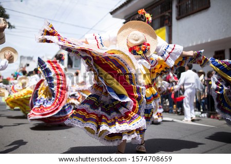 woman dancing in ibagué colombia san pedro carnaval Royalty-Free Stock Photo #1574708659
