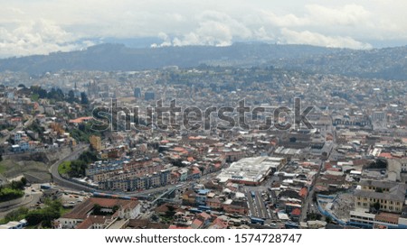Aerial shot of Quito landscape on a cloudy sunny day