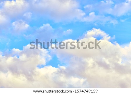 Blue sky with clouds on a bright day. Nature background.
